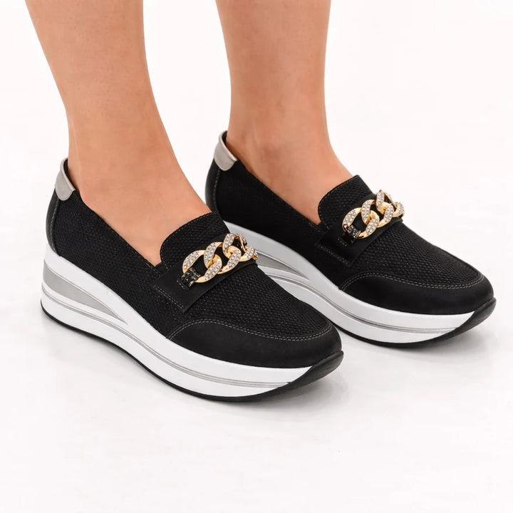 Zapatillas Calliope color negro, vista lateral del par