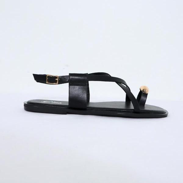 Sandalias planas color negro, vista lateral